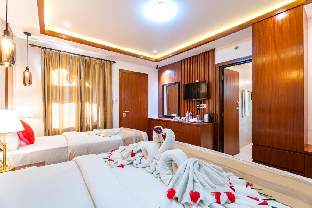 Postel nebo postele na pokoji v ubytování Hotel Seven Limited