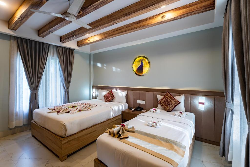 Postel nebo postele na pokoji v ubytování Hotel Seven Limited