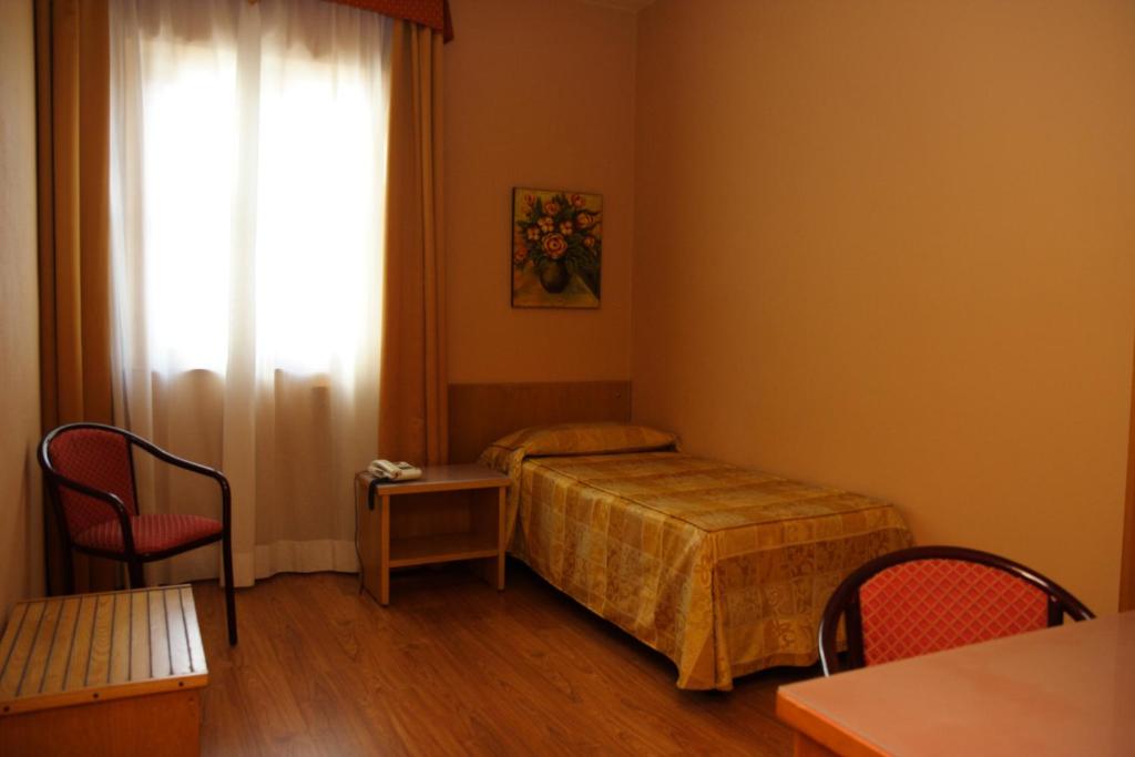 Postel nebo postele na pokoji v ubytování Hotel Tre Torri