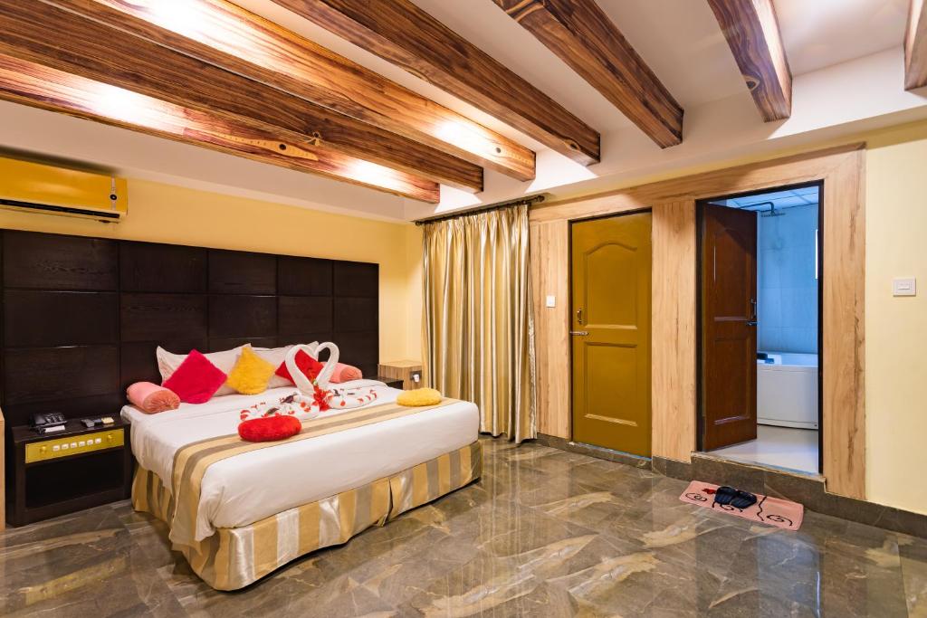 Postel nebo postele na pokoji v ubytování Hotel Seven Limited