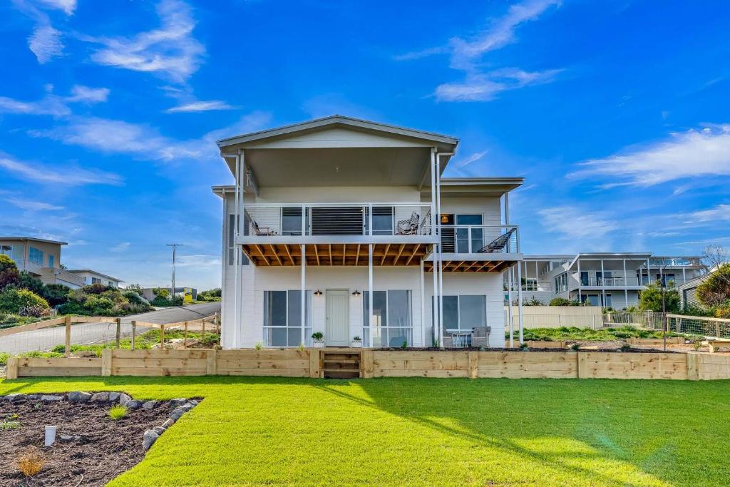 a house with a lawn in front of it at 66 Neighbour Ave Goolwa - Linen Provided in Goolwa South