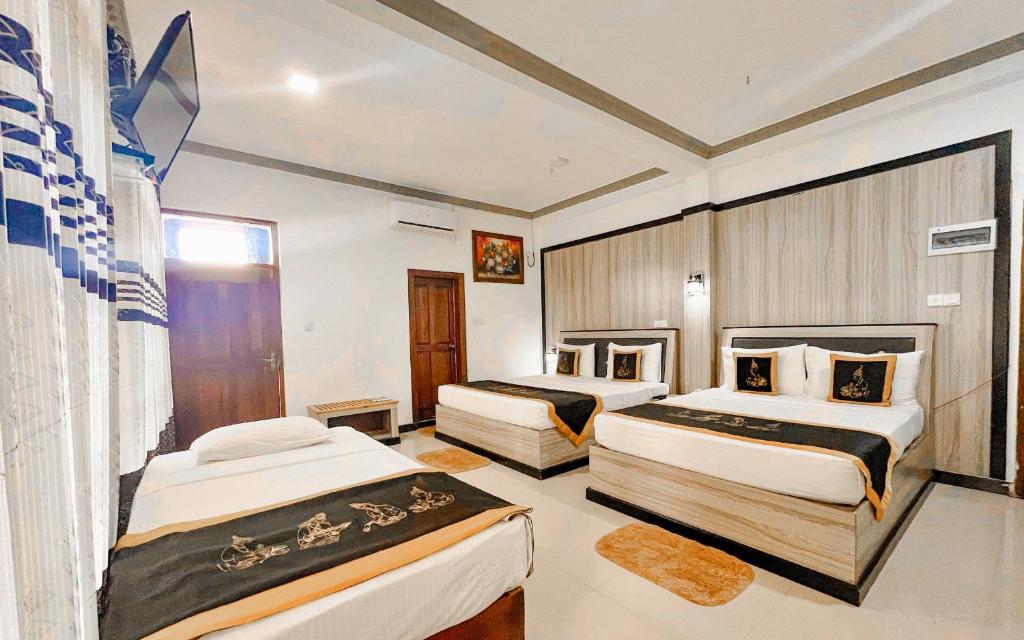 Postel nebo postele na pokoji v ubytování Sigiriya Kingdom Resort