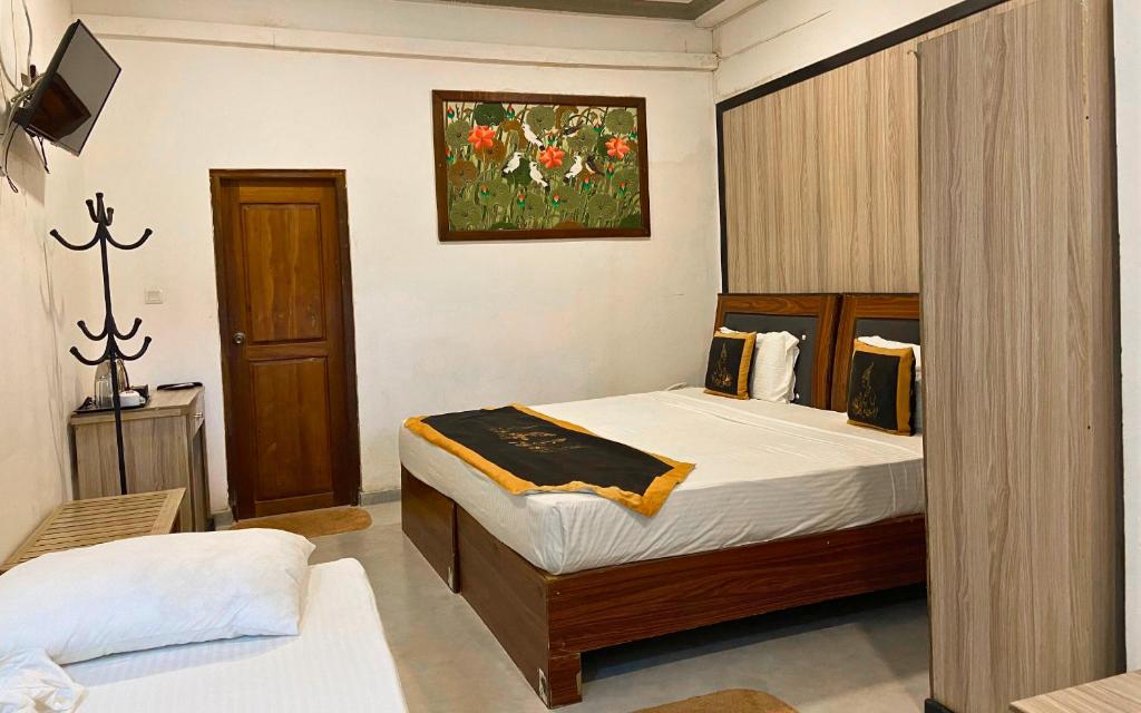 Postel nebo postele na pokoji v ubytování Sigiriya Kingdom Resort
