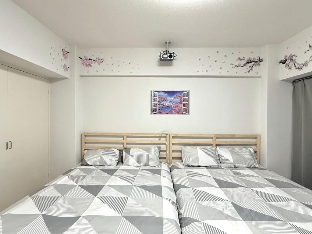 Postel nebo postele na pokoji v ubytování Shinjuku Wasedaハウス T3