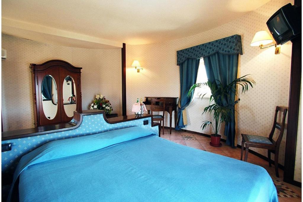 Postel nebo postele na pokoji v ubytování Hotel Tre Torri