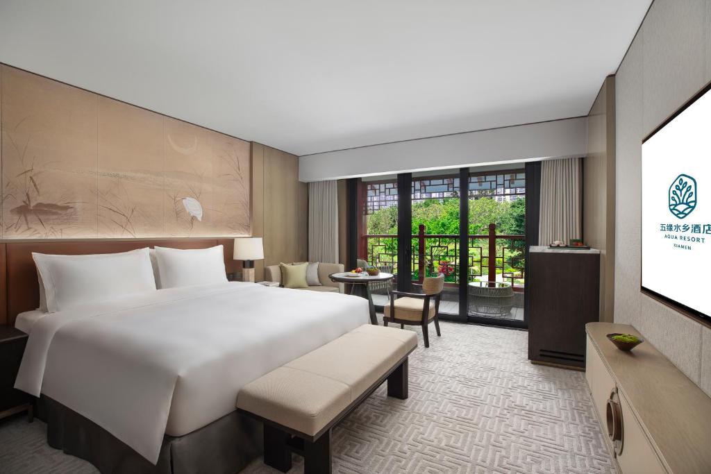 Postel nebo postele na pokoji v ubytování Xiamen Aqua Resort
