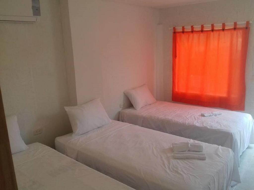 Postel nebo postele na pokoji v ubytování Manzanillo Beach