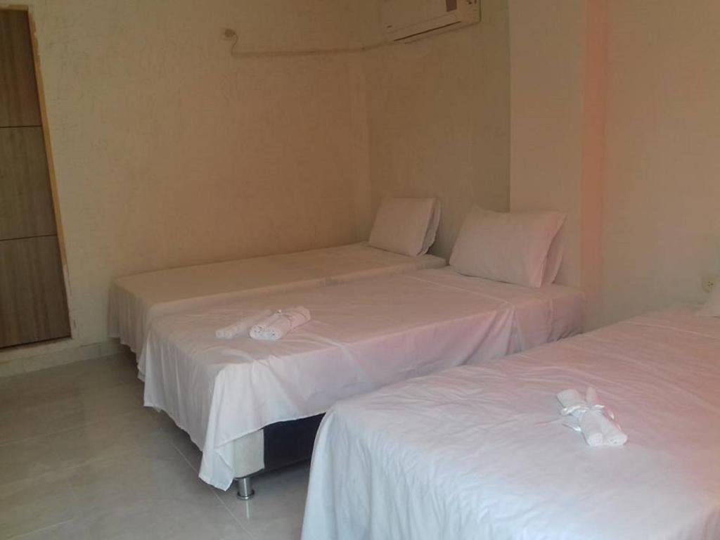 Postel nebo postele na pokoji v ubytování Manzanillo Beach