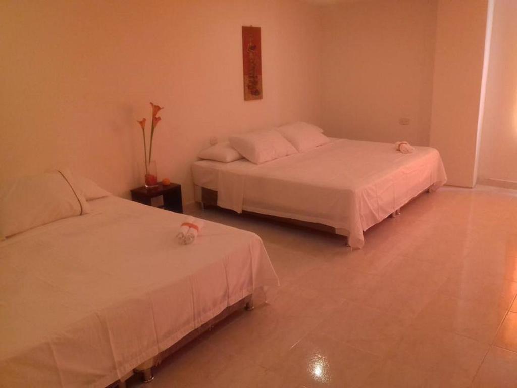 Postel nebo postele na pokoji v ubytování Manzanillo Beach