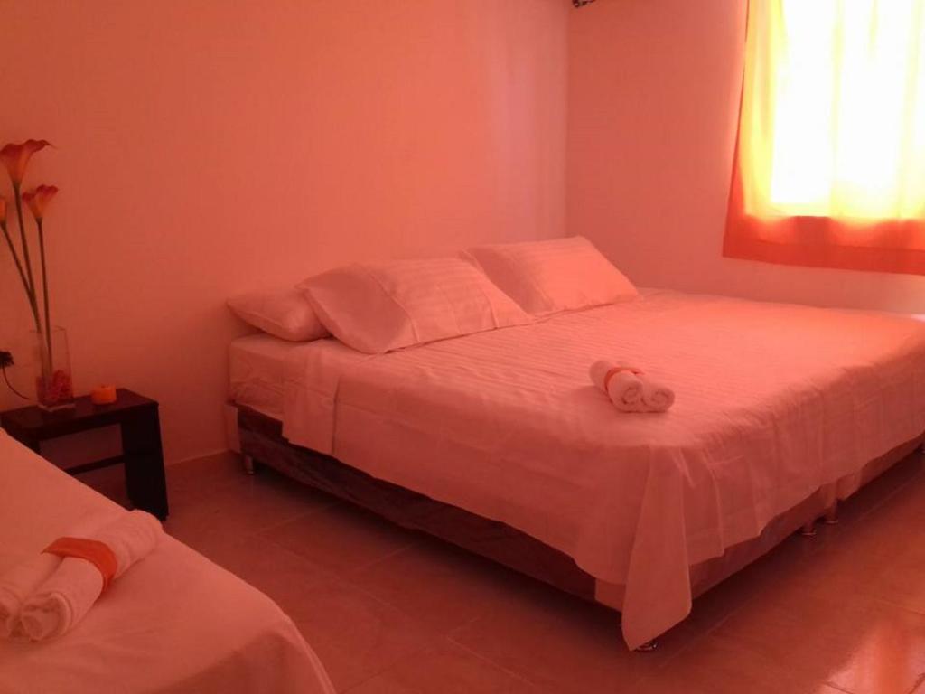 Postel nebo postele na pokoji v ubytování Manzanillo Beach