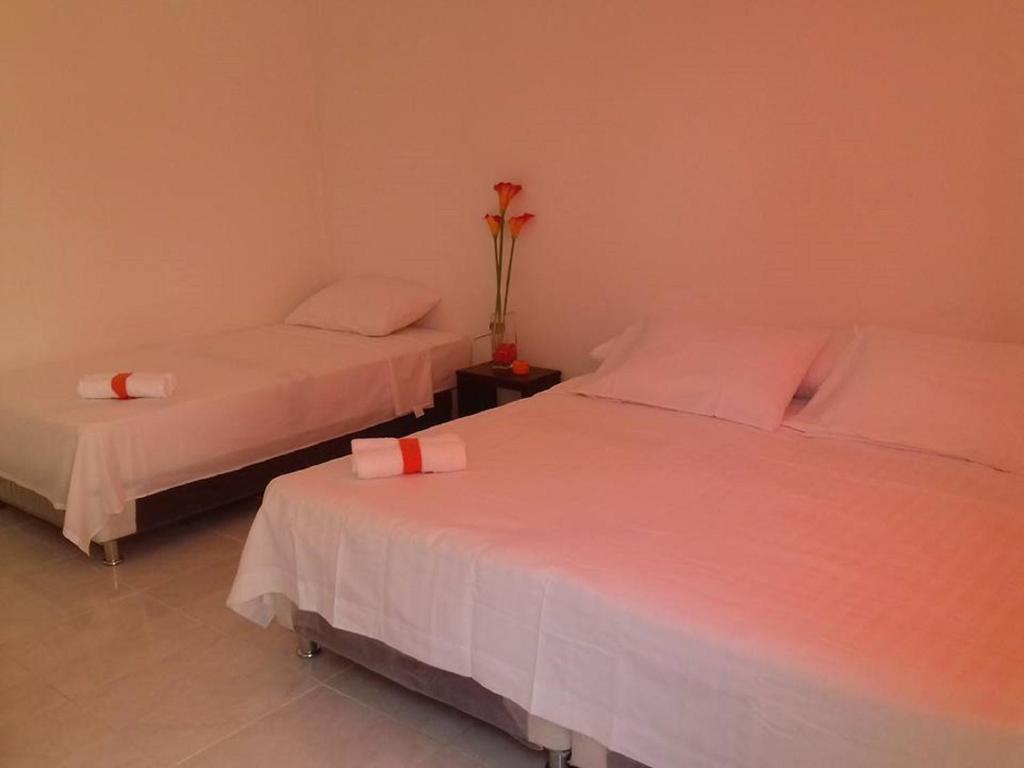 Postel nebo postele na pokoji v ubytování Manzanillo Beach