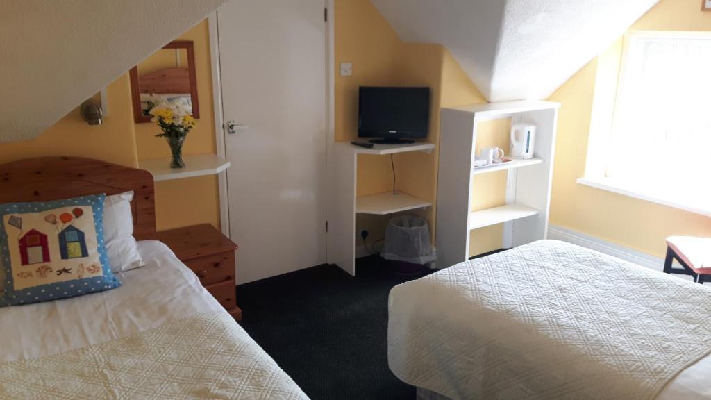 Letto o letti in una camera di Surfside Stop