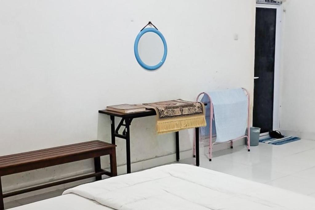 RedDoorz at Family Syariah Homestay kotamobagu - Chambre Double De Luxe