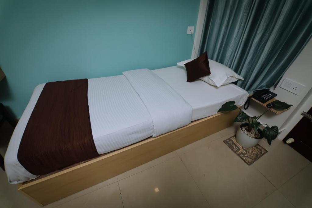 Letto o letti in una camera di Hotel Eastern