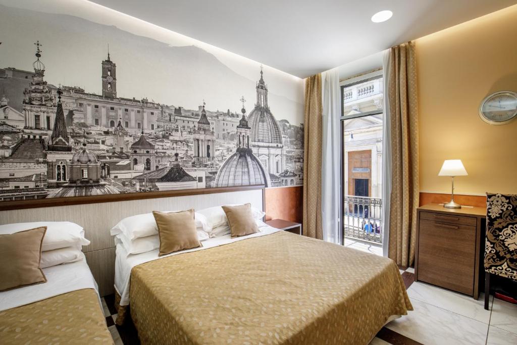 Posteľ alebo postele v izbe v ubytovaní Corso Grand Suite