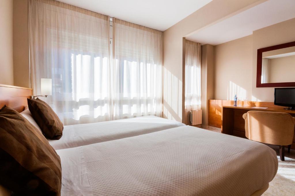 Postel nebo postele na pokoji v ubytování PARK SEDO Aparthotel