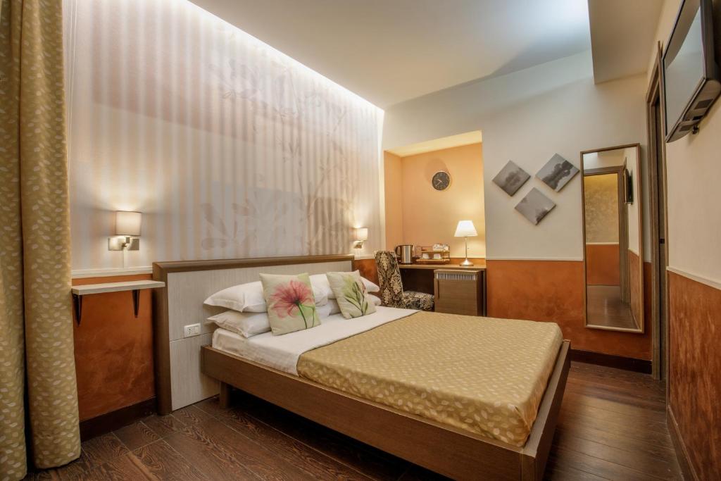 Posteľ alebo postele v izbe v ubytovaní Corso Grand Suite