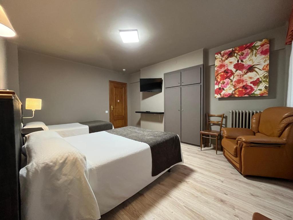 Postel nebo postele na pokoji v ubytování Hotel Juan Canejan