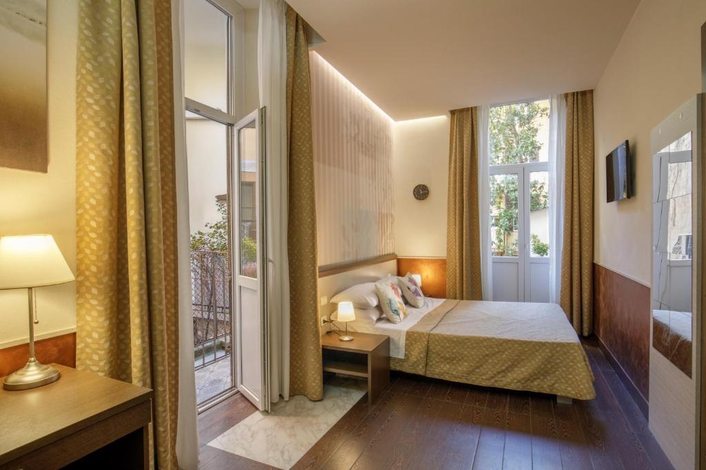 Posteľ alebo postele v izbe v ubytovaní Corso Grand Suite