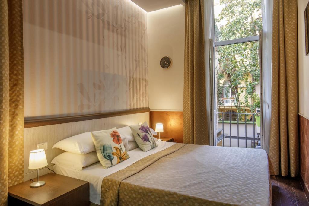 Posteľ alebo postele v izbe v ubytovaní Corso Grand Suite