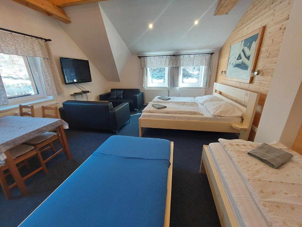 Postel nebo postele na pokoji v ubytování U Veselé lišky