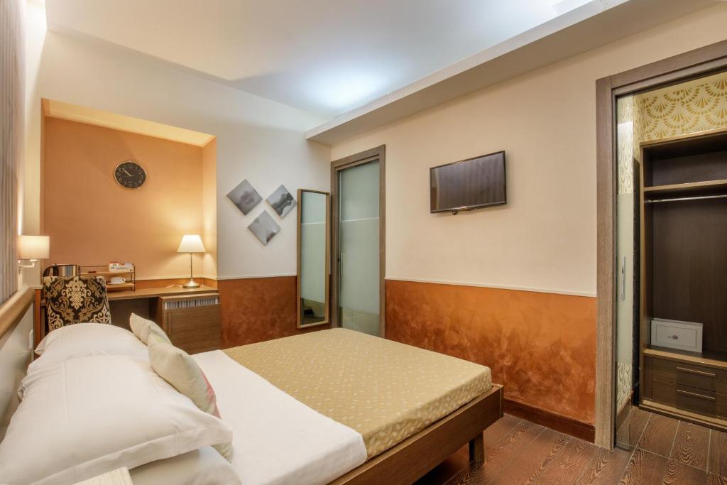 Posteľ alebo postele v izbe v ubytovaní Corso Grand Suite
