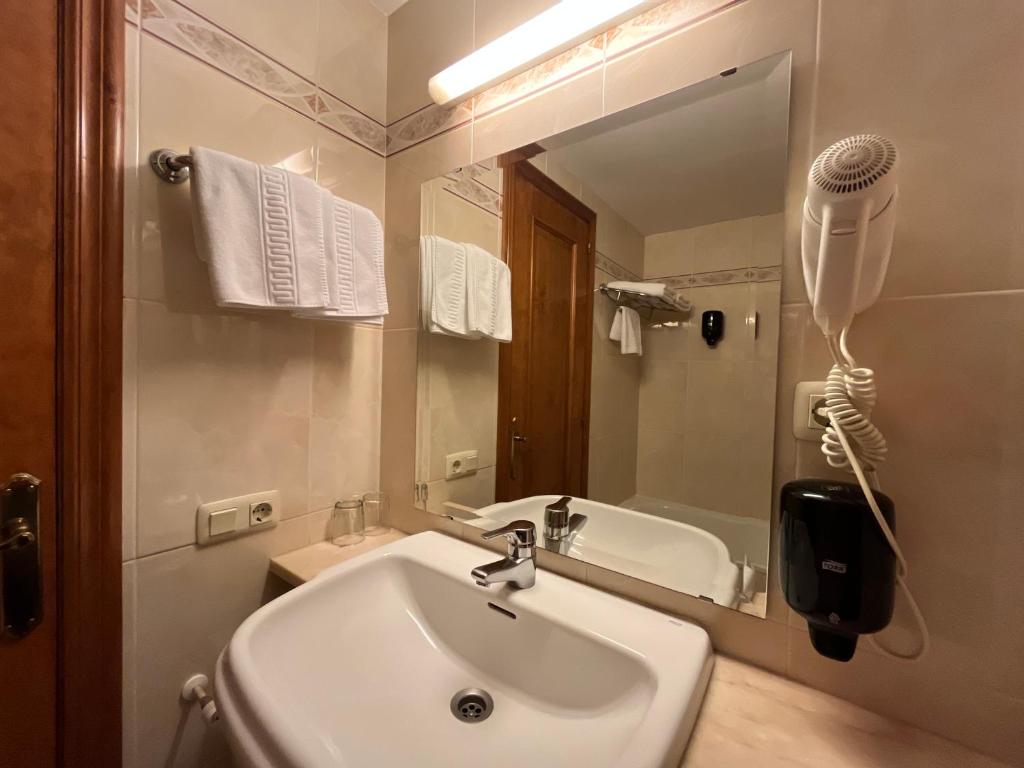 Koupelna v ubytování Hotel Juan Canejan