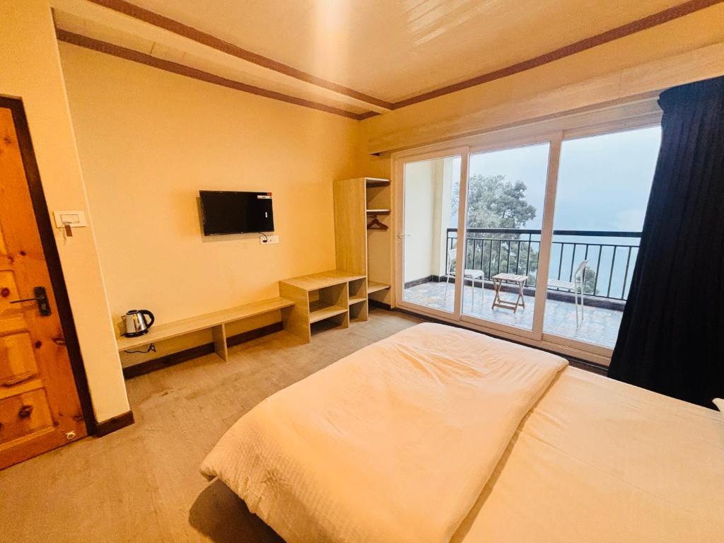TV a/nebo společenská místnost v ubytování Asraya Homestay