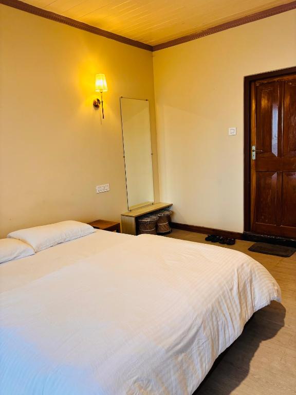 Postel nebo postele na pokoji v ubytování Asraya Homestay