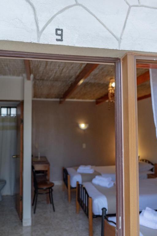 Postel nebo postele na pokoji v ubytování Hostal Katarpe