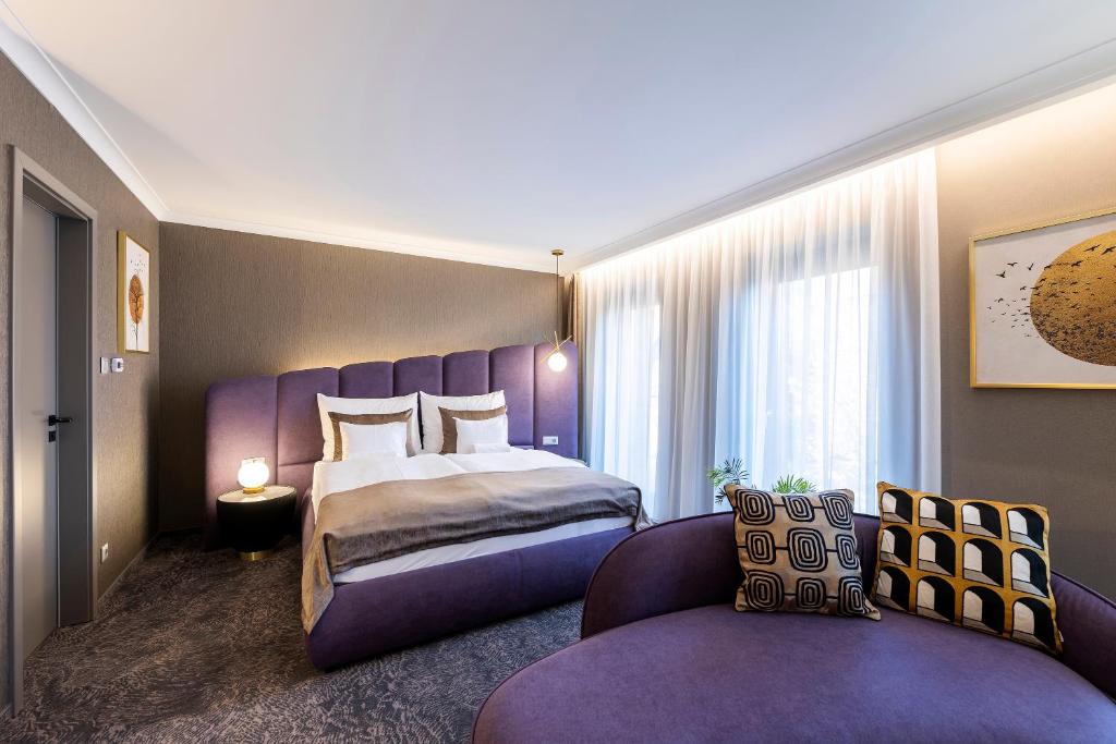 Postel nebo postele na pokoji v ubytování Riva Prestige Hotel