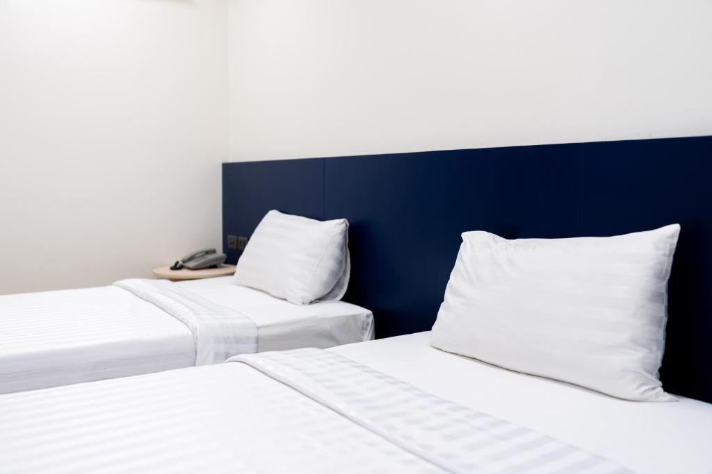 Postel nebo postele na pokoji v ubytování CA Hotel and Residence Phuket - SHA Extra Plus