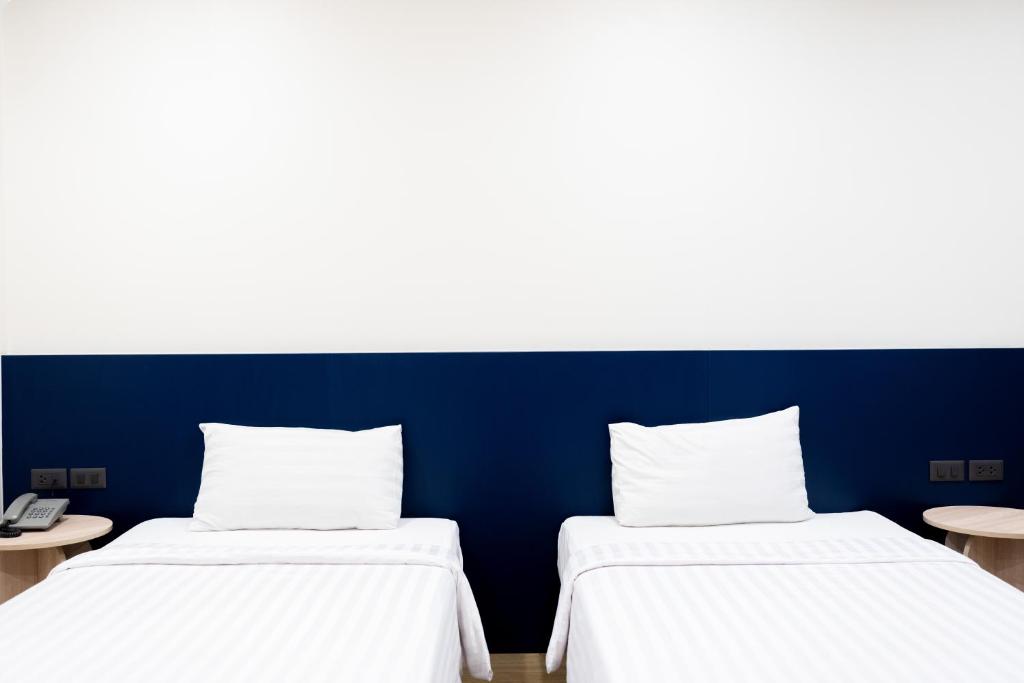 Postel nebo postele na pokoji v ubytování CA Hotel and Residence Phuket - SHA Extra Plus