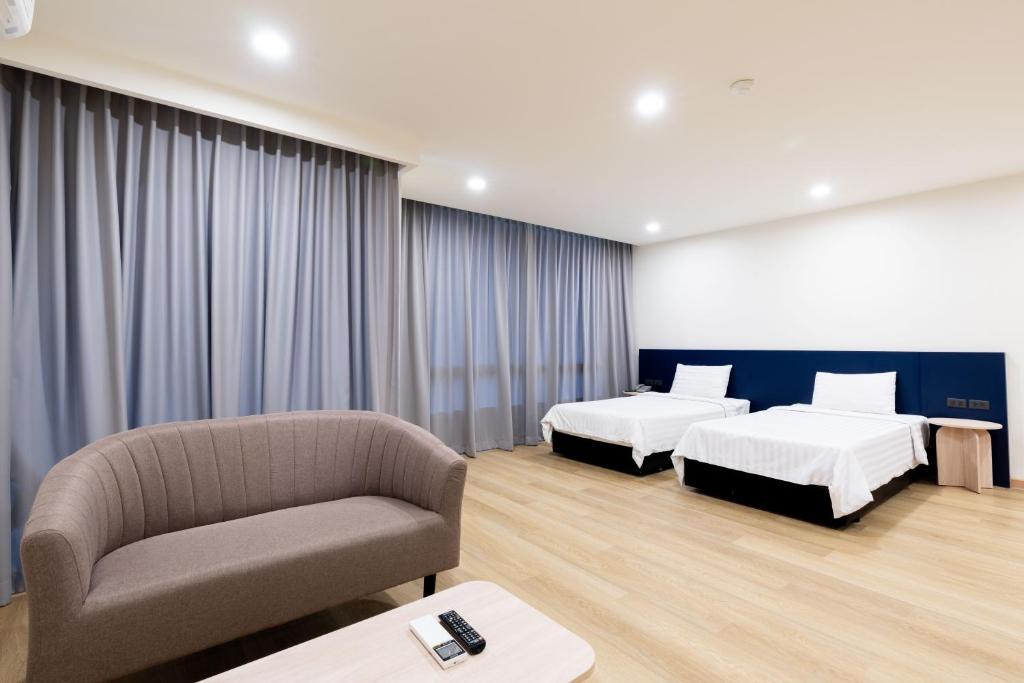 Postel nebo postele na pokoji v ubytování CA Hotel and Residence Phuket - SHA Extra Plus