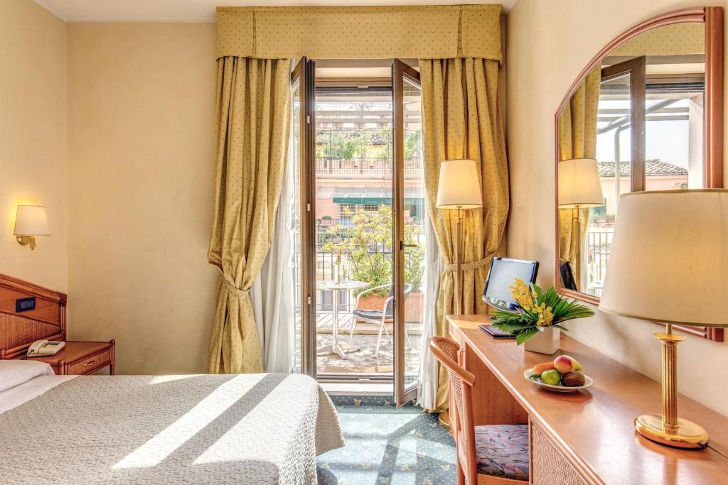 Postel nebo postele na pokoji v ubytování Hotel King