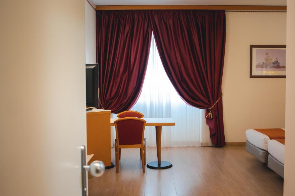 Posteľ alebo postele v izbe v ubytovaní Best Western Mirage Hotel Fiera