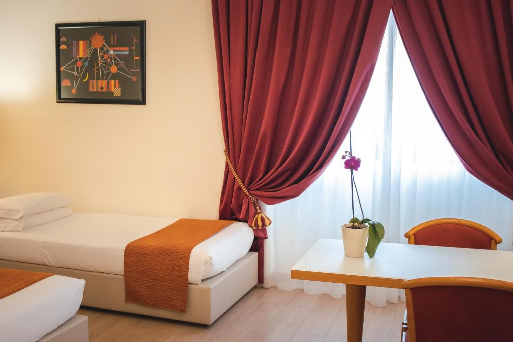 Posteľ alebo postele v izbe v ubytovaní Best Western Mirage Hotel Fiera