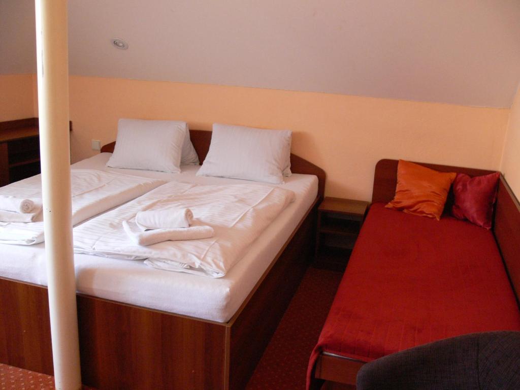 Postel nebo postele na pokoji v ubytování Penzion Oaza