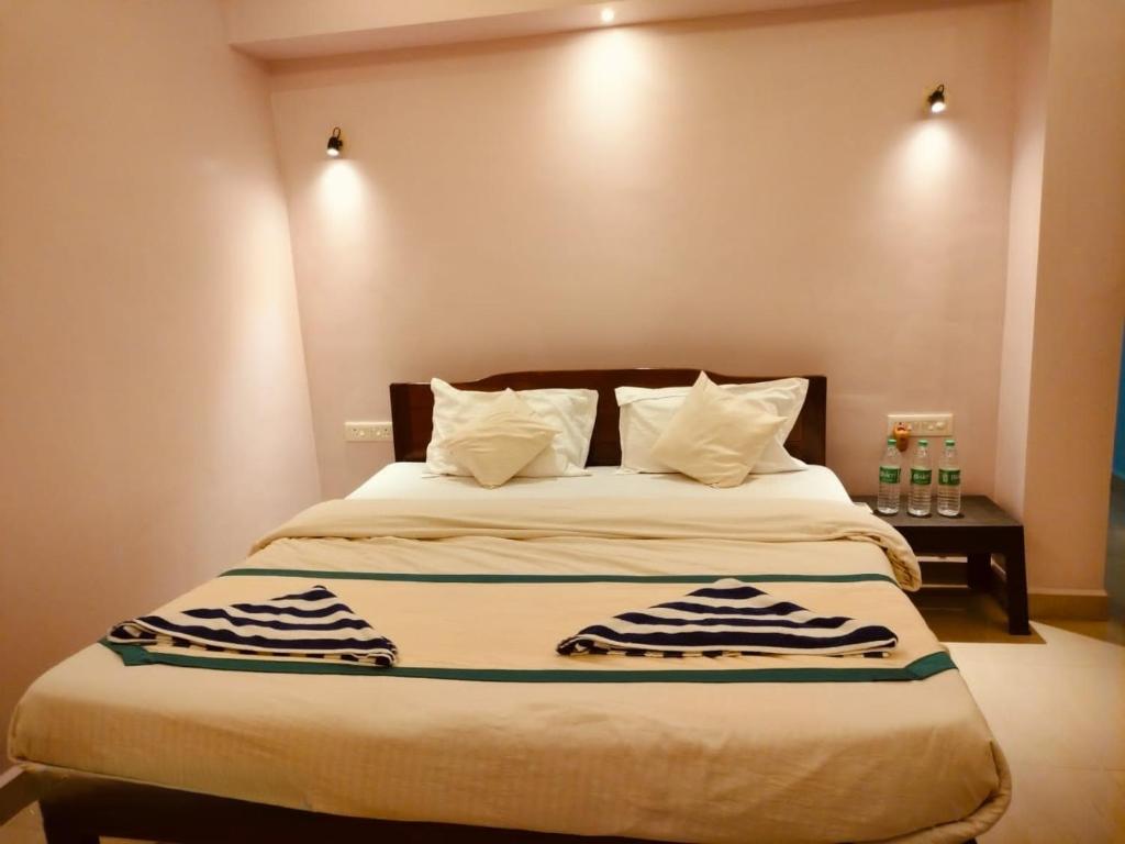 Postel nebo postele na pokoji v ubytování Royalstar Resort