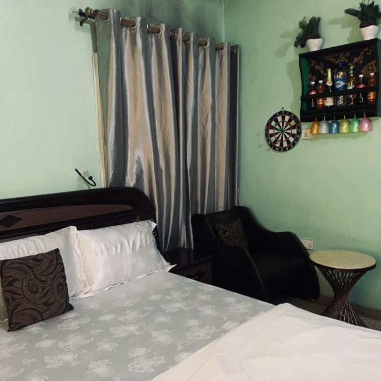 Postel nebo postele na pokoji v ubytování Health Plaza Abuja