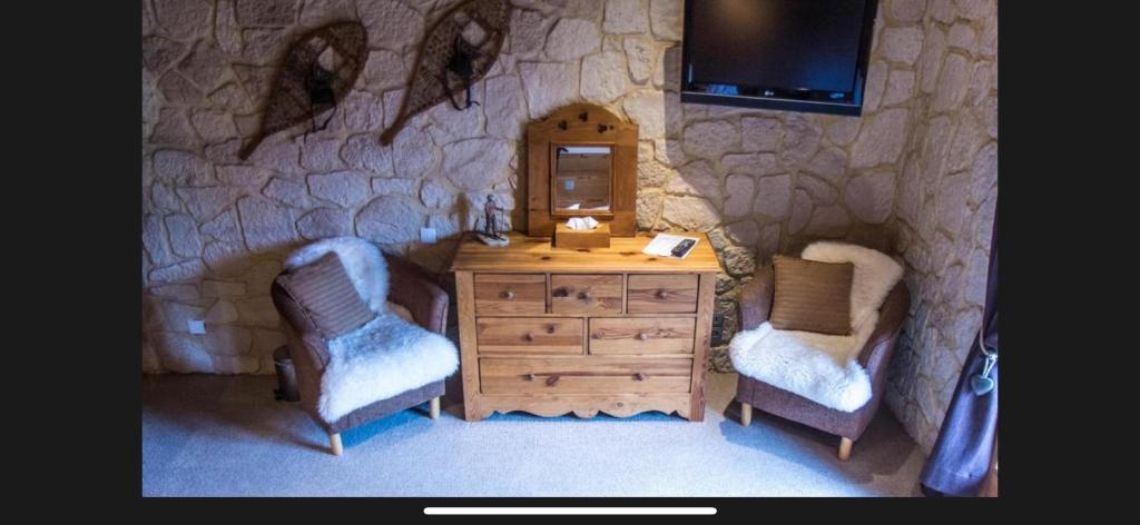 Posezení v ubytování Hôtel Chalet Alpage