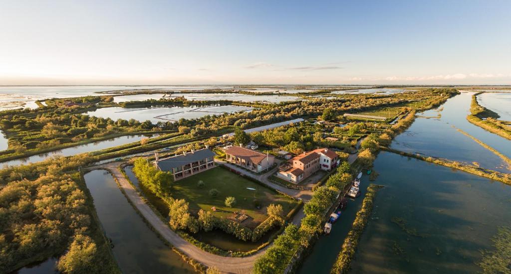 an aerial view of a house on a river at Agriturismo La Barena in Jesolo