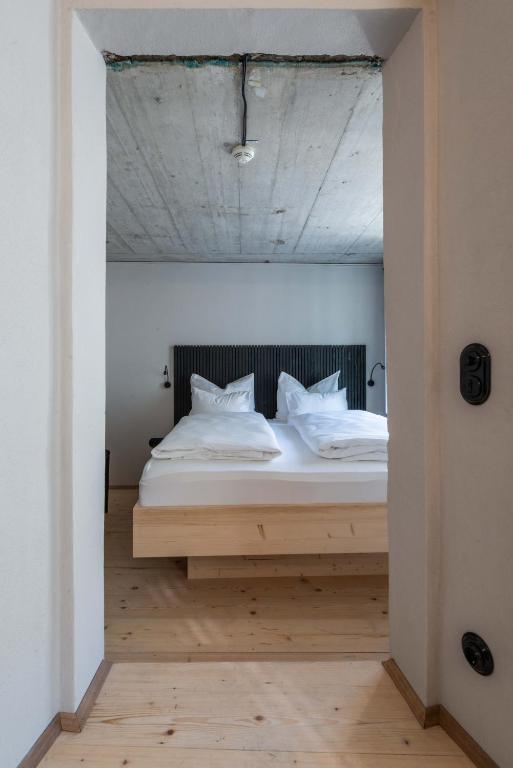 Postel nebo postele na pokoji v ubytování Hotel Kühbacher