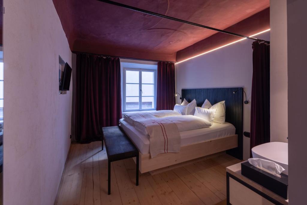 Postel nebo postele na pokoji v ubytování Hotel Kühbacher
