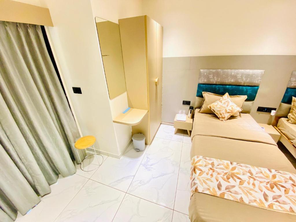 Postel nebo postele na pokoji v ubytování Hotel RV Residency