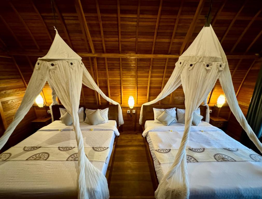Postel nebo postele na pokoji v ubytování Kubu Bakas Guest House