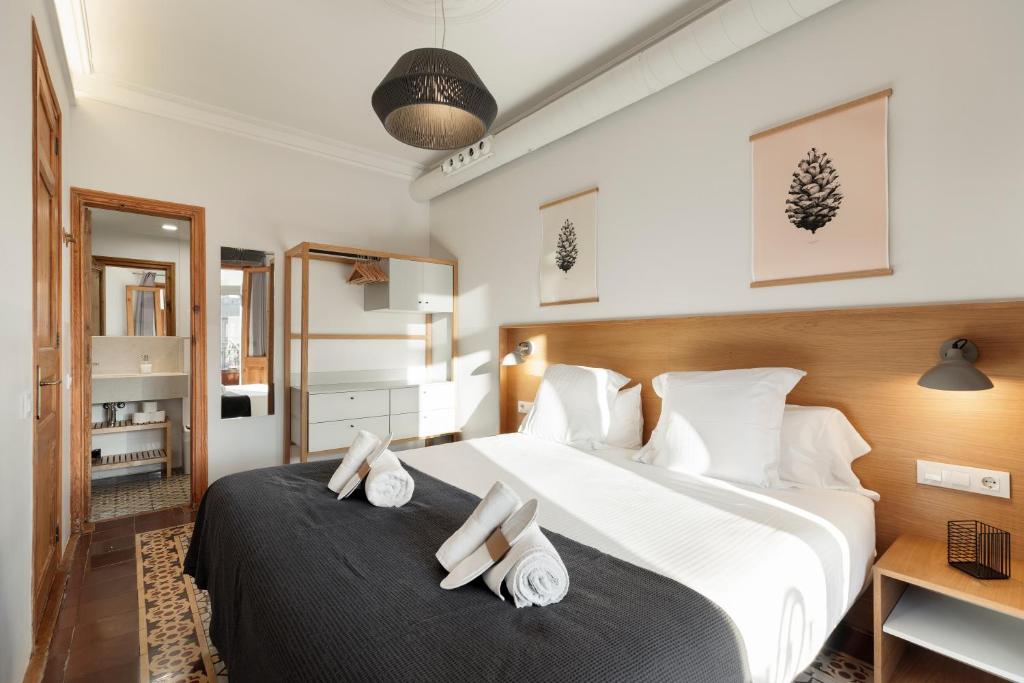 Postel nebo postele na pokoji v ubytování Central Apartments Barcelona