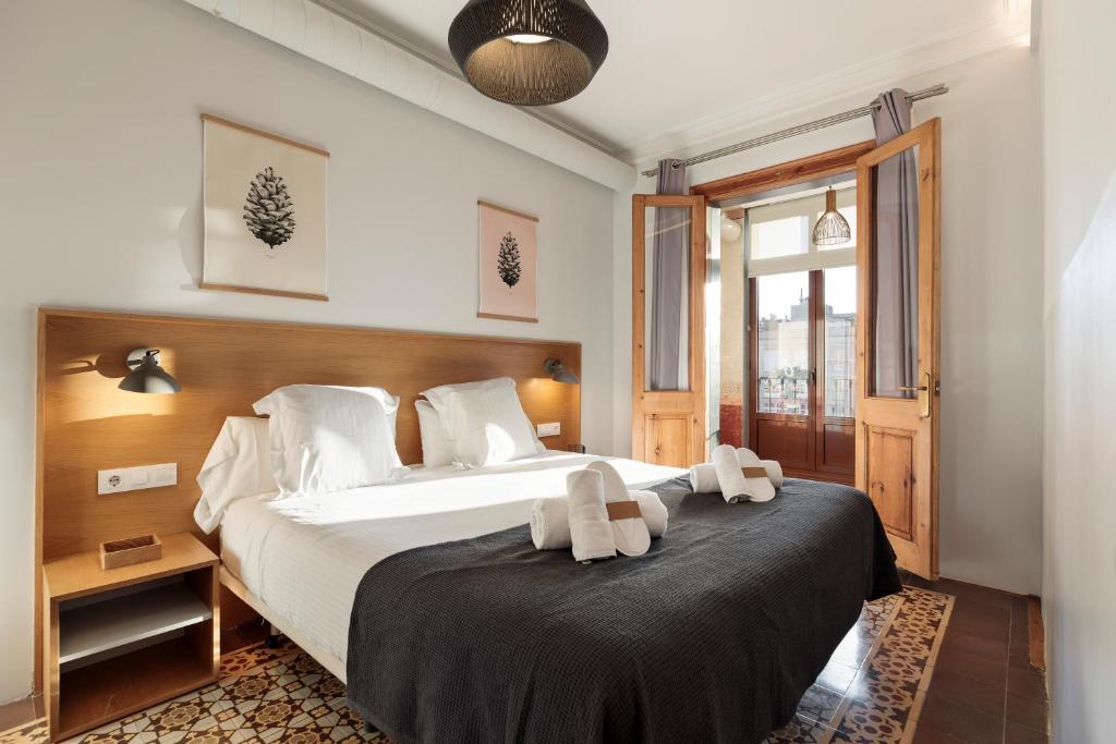 Postel nebo postele na pokoji v ubytování Central Apartments Barcelona