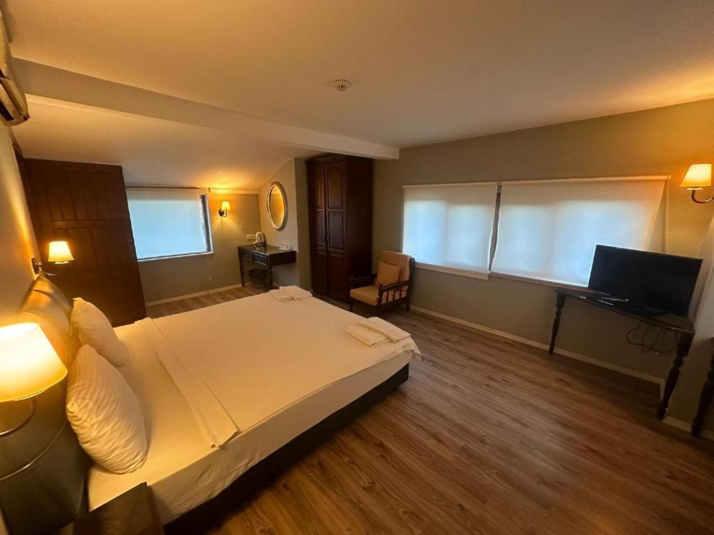 Postel nebo postele na pokoji v ubytování Akkent Garden Hotel