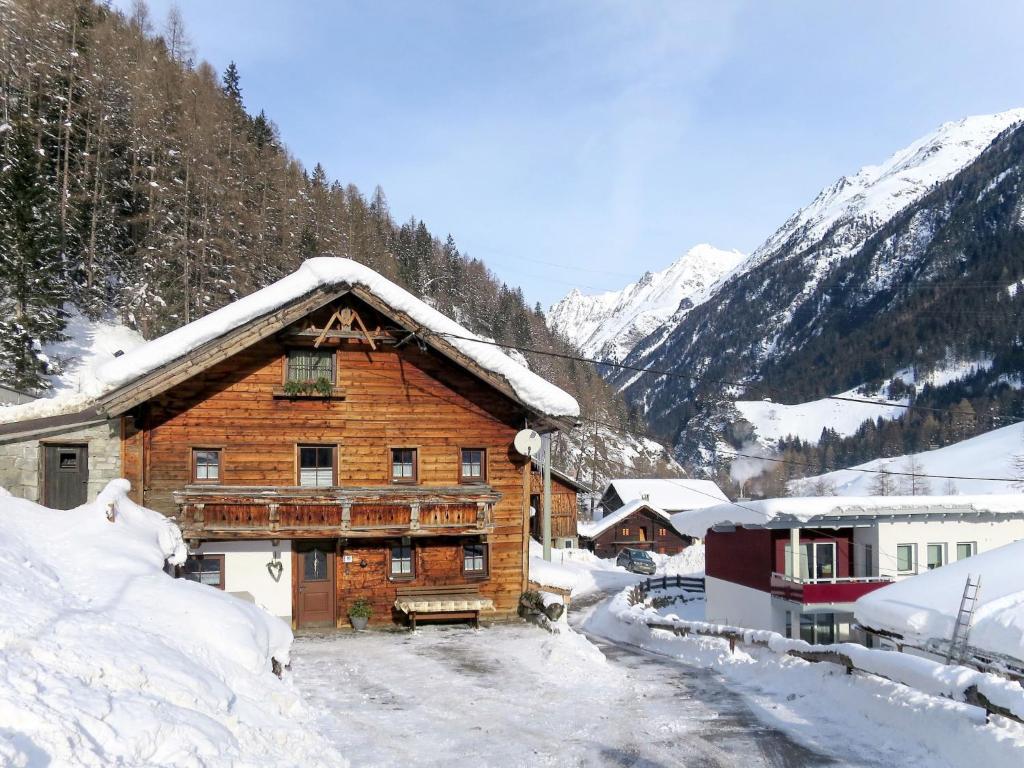 a log cabin in the snow with mountains at Chalet Hannelore-3 by Interhome in Sölden